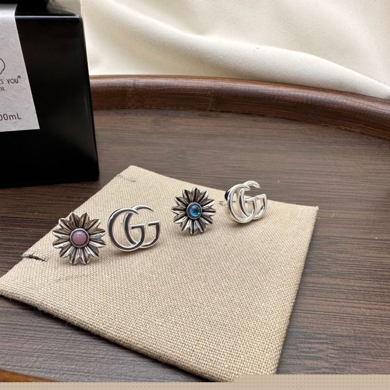 G*u*i earrings
